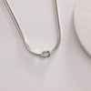 Dainty Silver Knot Necklace – A Timeless Symbol of Connection and Strength